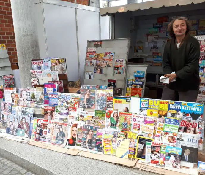 A news vendor by Triple Bridge, Ljubljana