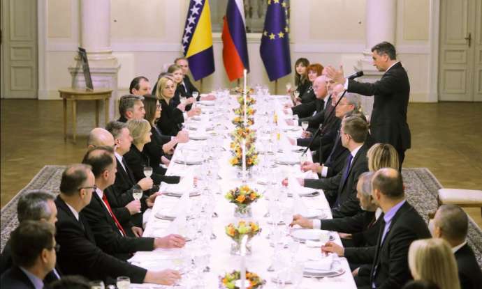 President Pahor, standing, speaks to the group